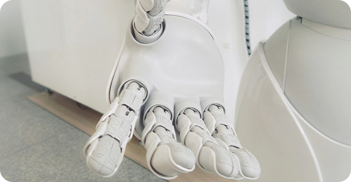 A white robot hand with many fingers and one thumb.