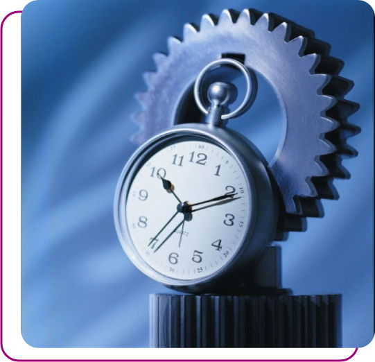 A clock is shown with gears on top of it.